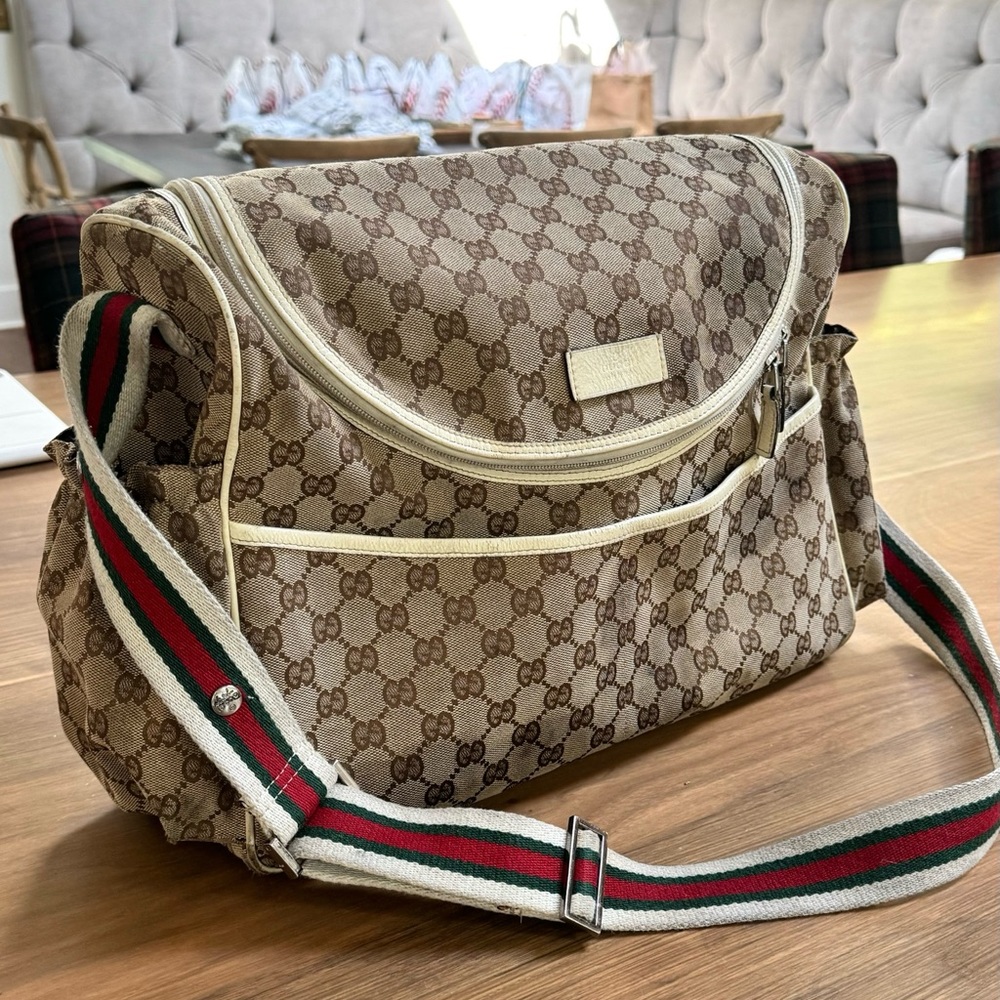 Gucci diaper bag with striped strap
